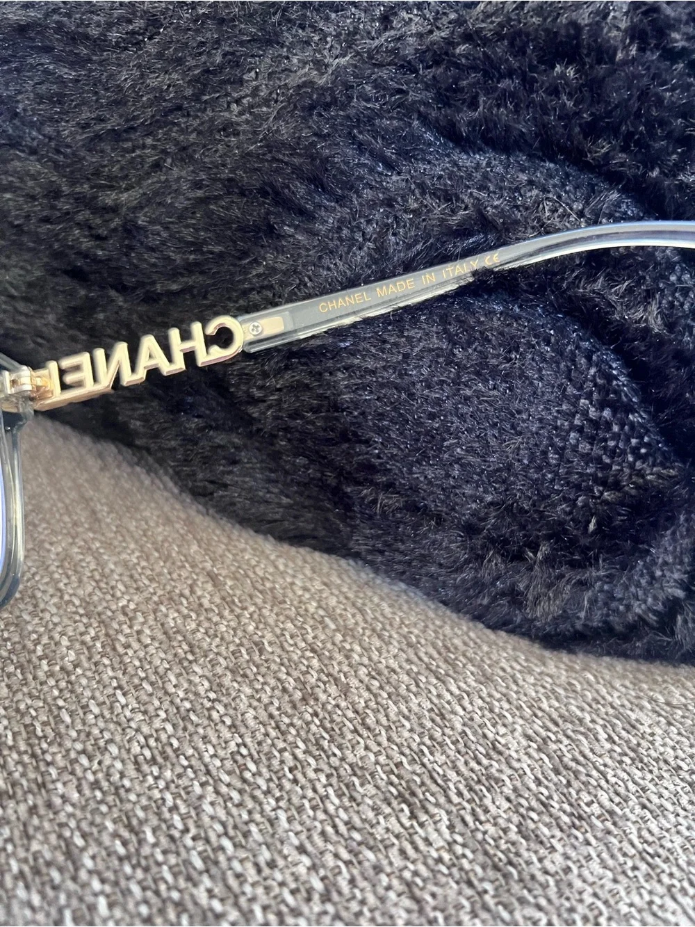 CHANEL Transparent Light Blue Frame Glasses with Gold Logos